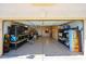 Spacious two-car garage with built-in storage and an epoxy-coated floor at 10832 W Piute Ave, Peoria, AZ 85373