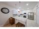 Well-lit kitchen featuring quartz countertops, stainless steel appliances, and tile flooring at 10832 W Piute Ave, Peoria, AZ 85373