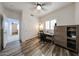 Bright office with wood-look floors, ceiling fan, and work space at 10832 W Piute Ave, Peoria, AZ 85373