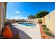 Backyard pool with beautiful landscaping, an outdoor seating area, and mature trees at 10832 W Piute Ave, Peoria, AZ 85373