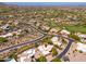 Aerial view of a golf community with a desert landscape showcases the community's layout and recreational amenities at 10901 E Quarry E Trl, Scottsdale, AZ 85262