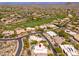 Aerial view of a golf community with desert landscaping highlighting the community's layout and recreational amenities at 10901 E Quarry E Trl, Scottsdale, AZ 85262