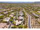 An aerial view showcases the community's desert landscape, with its winding roads and stunning mountain views at 10901 E Quarry E Trl, Scottsdale, AZ 85262