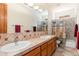Bathroom featuring double sinks, tile countertops, and a shower/tub combo at 10901 E Quarry E Trl, Scottsdale, AZ 85262