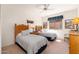Cozy bedroom featuring twin beds, Southwestern decor, and ample natural light at 10901 E Quarry E Trl, Scottsdale, AZ 85262