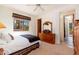 Carpeted bedroom with a window and doorway at 10901 E Quarry E Trl, Scottsdale, AZ 85262