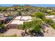 Desert home with an attached garage with lush landscaping and desert views at 10901 E Quarry E Trl, Scottsdale, AZ 85262