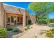 Inviting front entrance with a charming walkway, desert plants, and a beautiful front door at 10901 E Quarry E Trl, Scottsdale, AZ 85262