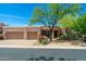 Charming home with a well-maintained front yard, desert landscaping and a two-car garage at 10901 E Quarry E Trl, Scottsdale, AZ 85262