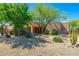 Attractive home with desert landscaping, mature trees, and a welcoming entrance at 10901 E Quarry E Trl, Scottsdale, AZ 85262