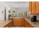 Modern kitchen with granite counters, stainless appliances, and eat-in dining area at 10901 E Quarry E Trl, Scottsdale, AZ 85262