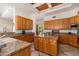Spacious kitchen with granite countertops, stainless appliances, and backyard access at 10901 E Quarry E Trl, Scottsdale, AZ 85262