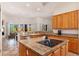 Bright kitchen boasts granite countertops, center island, and stainless steel appliances at 10901 E Quarry E Trl, Scottsdale, AZ 85262