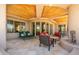 Spacious covered patio featuring a fireplace and comfortable seating with views at 10901 E Quarry E Trl, Scottsdale, AZ 85262