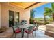 Relaxing outdoor patio features a dining table, grill, and comfortable seating perfect for entertaining guests at 10901 E Quarry E Trl, Scottsdale, AZ 85262
