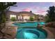 Inviting backyard featuring a private pool and spa, perfect for relaxation and entertaining under the evening sky at 10901 E Quarry E Trl, Scottsdale, AZ 85262