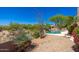 A backyard pool is surrounded by desert landscaping, including native plants, cacti, and succulents at 10901 E Quarry E Trl, Scottsdale, AZ 85262