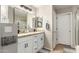 Bathroom featuring double sinks with granite countertops, vanity, large mirror, and tile floors at 11133 E Dragoon Ave, Mesa, AZ 85208