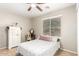 Cozy bedroom featuring a comfortable bed, window with blinds, and a vintage-style dresser at 11133 E Dragoon Ave, Mesa, AZ 85208