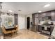 This kitchen features gray cabinets, stainless steel appliances, tile floors, and a dining table at 11133 E Dragoon Ave, Mesa, AZ 85208