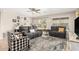 Inviting living room features comfortable seating, neutral paint, a ceiling fan, and sliding glass doors at 11133 E Dragoon Ave, Mesa, AZ 85208