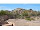 Fenced backyard with desert landscaping provides privacy and mountain views at 11856 E Parkview Ln, Scottsdale, AZ 85255