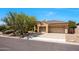 Charming single-story home with a two-car garage and desert landscaping in a gated community at 11856 E Parkview Ln, Scottsdale, AZ 85255