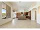 Gourmet kitchen boasts custom cabinetry, granite countertops, and stainless steel appliances with travertine floors at 11856 E Parkview Ln, Scottsdale, AZ 85255