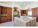 Gourmet kitchen featuring granite countertops, custom cabinets, and top-of-the-line stainless steel appliances at 11856 E Parkview Ln, Scottsdale, AZ 85255