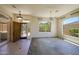 Spacious living room with decorative tile and large windows, offering an abundance of natural light at 11856 E Parkview Ln, Scottsdale, AZ 85255