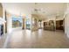 Bright living room features large windows with scenic views and a modern kitchen with stainless appliances at 11856 E Parkview Ln, Scottsdale, AZ 85255