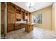 Home office featuring custom built-in shelving and cabinetry, perfect for a workspace at 11856 E Parkview Ln, Scottsdale, AZ 85255