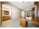 Home office view featuring built in shelving, a ceiling fan and desk at 11856 E Parkview Ln, Scottsdale, AZ 85255