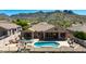 Backyard oasis with a refreshing pool, spa, beautiful patio area, and picturesque mountain backdrop at 11856 E Parkview Ln, Scottsdale, AZ 85255