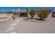 Backyard featuring desert landscaping, a stone pathway, and the home's exterior at 13305 W Colter St, Litchfield Park, AZ 85340