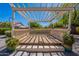 Inviting backyard featuring a covered patio area, perfect for relaxing and entertaining outdoors at 13305 W Colter St, Litchfield Park, AZ 85340
