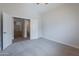 Bedroom featuring neutral walls, carpet flooring, ceiling fan, and an ensuite bath at 13305 W Colter St, Litchfield Park, AZ 85340