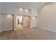 Spacious bedroom with neutral carpet and recessed lighting, leading to bathroom area at 13305 W Colter St, Litchfield Park, AZ 85340