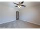 Bedroom featuring ceiling fan, doorway, and carpet flooring at 13305 W Colter St, Litchfield Park, AZ 85340