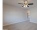 Bedroom with carpet flooring, a ceiling fan, and an arched window with natural light at 13305 W Colter St, Litchfield Park, AZ 85340