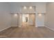 Bright bedroom featuring neutral carpet and modern recessed lighting, with bathroom view at 13305 W Colter St, Litchfield Park, AZ 85340