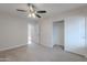 Bedroom with ceiling fan, closet, and doorway to another room at 13305 W Colter St, Litchfield Park, AZ 85340