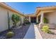 Inviting front entrance showcasing a pathway leading to double doors with decorative cacti and shrubs at 13305 W Colter St, Litchfield Park, AZ 85340