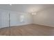 Bright and airy living room with wood floors, a double door entry, and neutral paint for versatile styling at 13305 W Colter St, Litchfield Park, AZ 85340