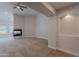 Spacious living room with decorative fireplace and neutral carpeting at 13305 W Colter St, Litchfield Park, AZ 85340