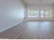 Open living space featuring large windows with natural light, and luxury vinyl flooring at 13305 W Colter St, Litchfield Park, AZ 85340