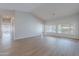 Light filled living room with wood-style floors and multiple windows at 13305 W Colter St, Litchfield Park, AZ 85340