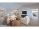 Spacious living area with modern furniture, open floor plan, and easy access to the dining room and kitchen at 13305 W Colter St, Litchfield Park, AZ 85340