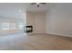 Living room featuring a fireplace and ceiling fan at 13305 W Colter St, Litchfield Park, AZ 85340
