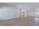 Bright, open living room with light wood floors and double door entry at 13305 W Colter St, Litchfield Park, AZ 85340